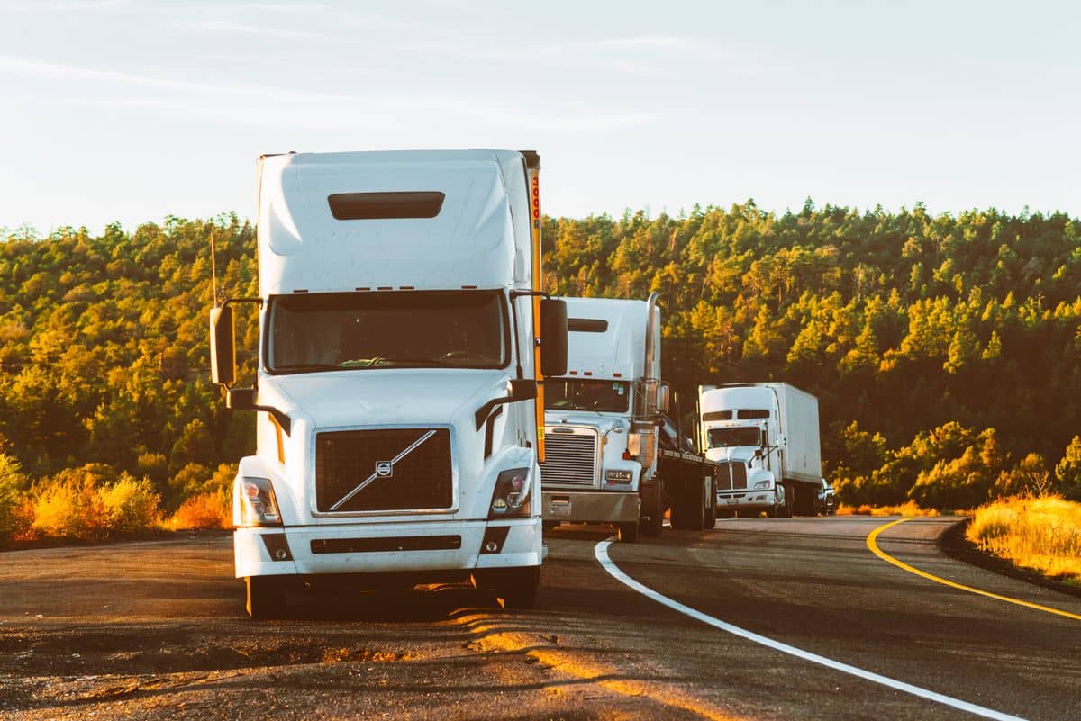 Semi-trailer truck driving down the highway